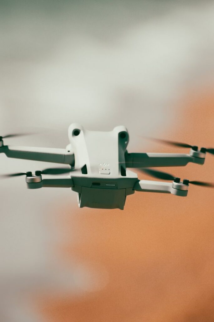 Close-up of a flying drone with blurred background, highlighting modern technology in motion.